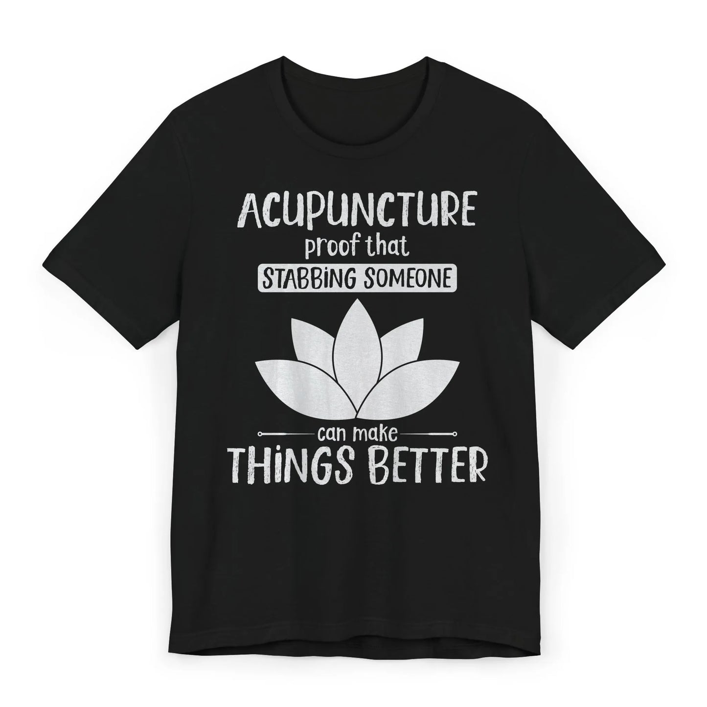 Black T-shirt with lotus and text “Acupuncture: Proof That Stabbing Someone Can Make Things Better.” Flat lay gift image.