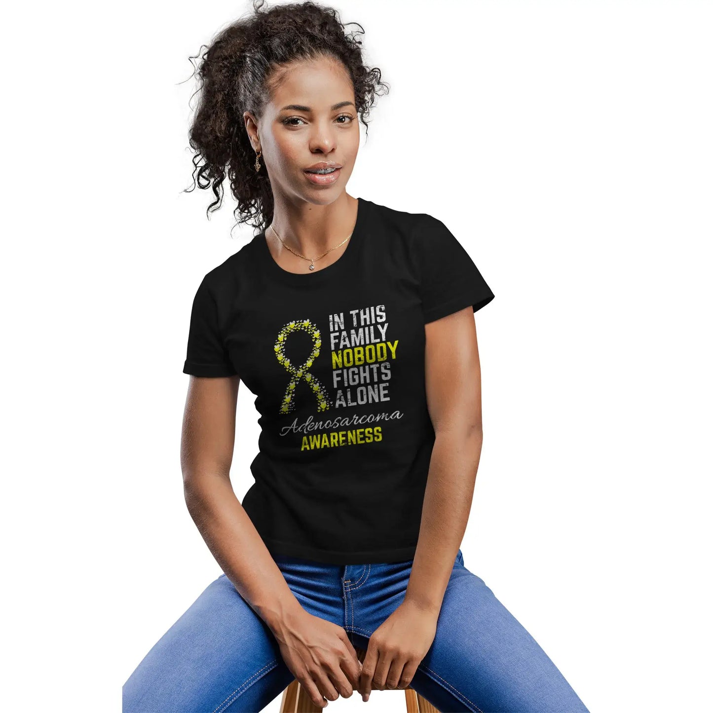 A woman wears the adenosarcoma awareness shirt to support rare cancer awareness and stand with fellow warriors.