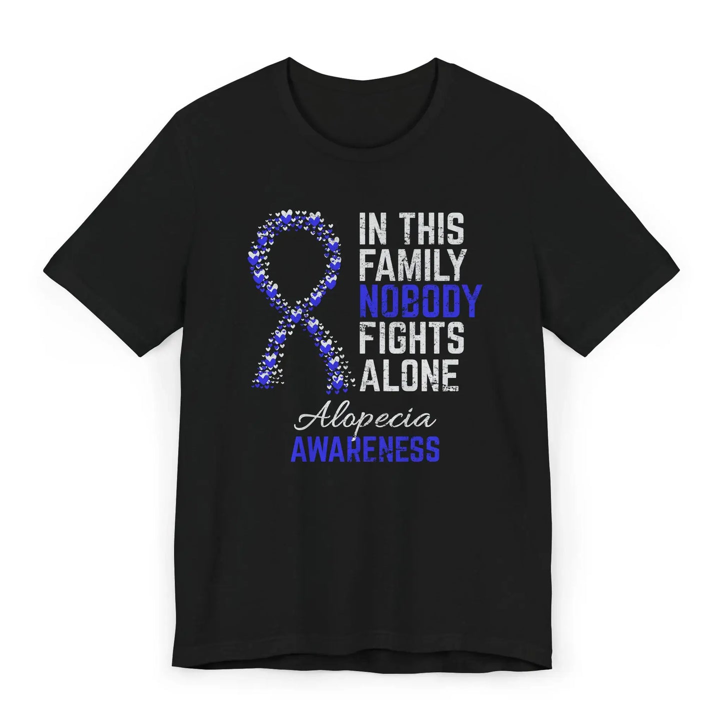 Flat image of the alopecia awareness T-shirt with a heart-filled ribbon and the quote “In This Family No One Fights Alone.”