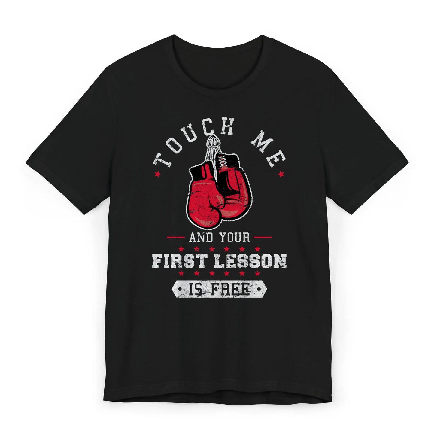 Flat lay of a boxing shirt with red gloves and quote "Touch Me and Your First Lesson Is Free."