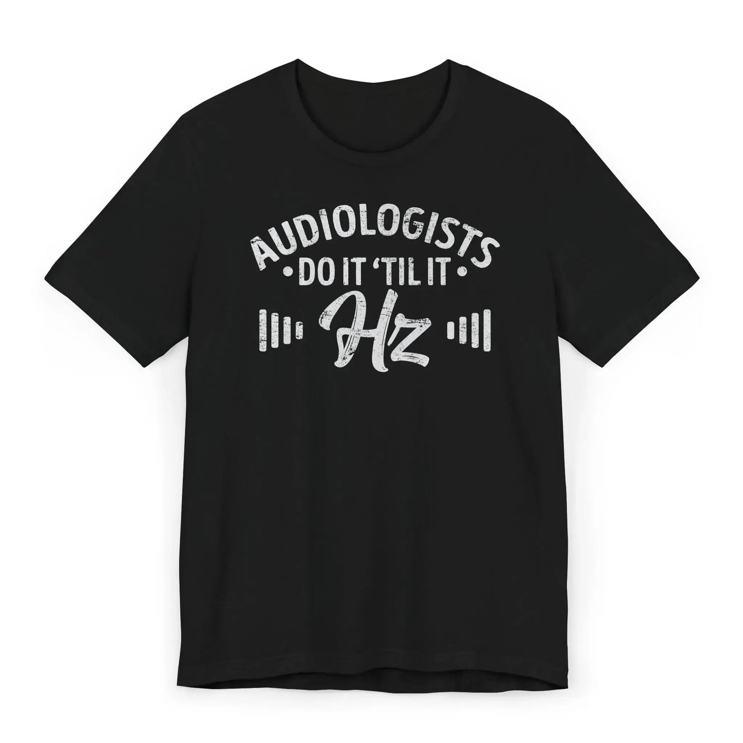 Flatlay of Do It ’Til It Hz audiologist shirt with pun and wave