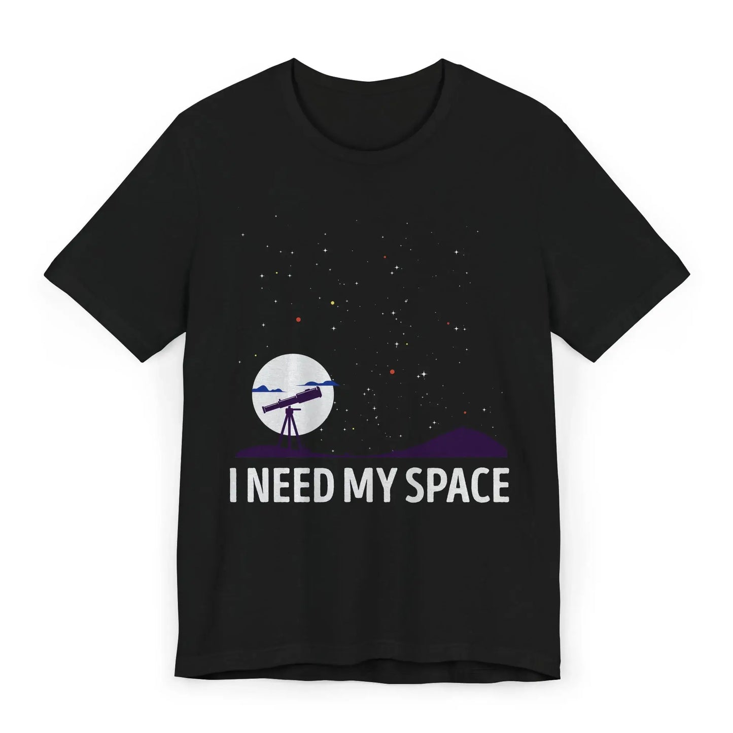 Flatlay of I Need My Space shirt with telescope and stars