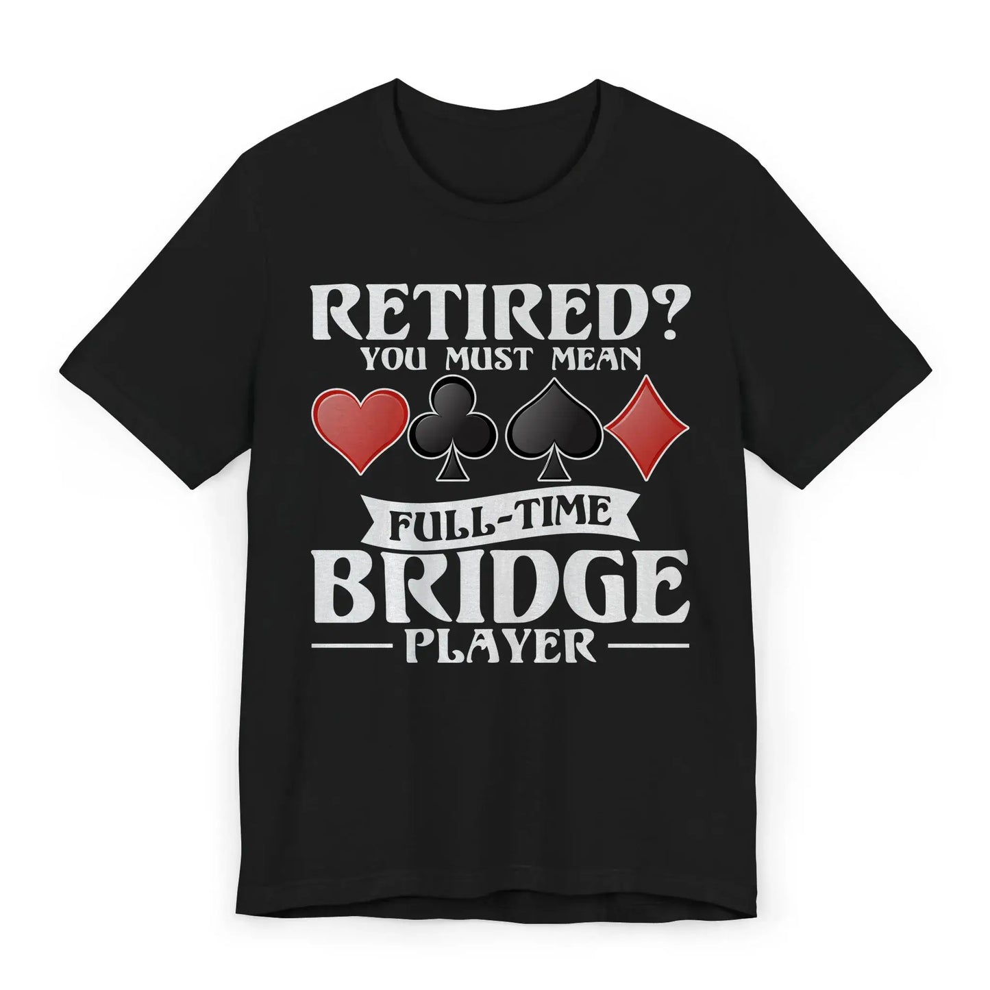 Flat lay of bridge player shirt with quote “Retired? You Must Mean Full-Time Bridge Player” and card suit symbols.
