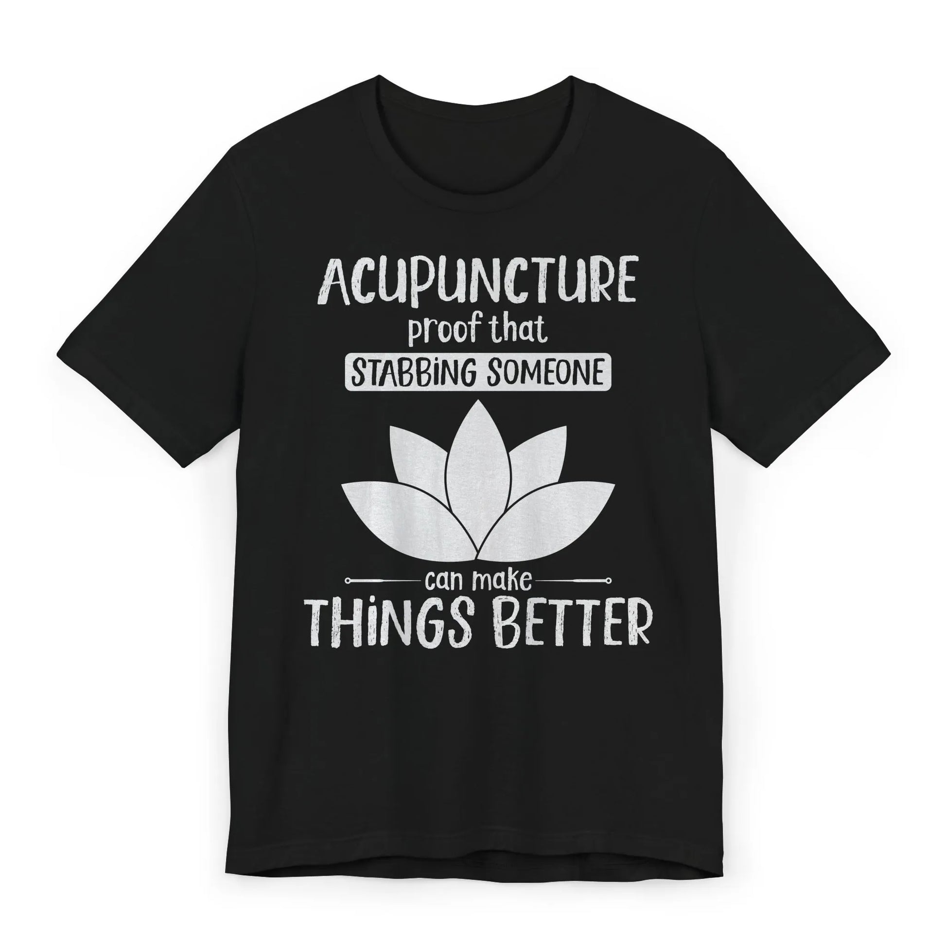 Black T-shirt with lotus and text “Acupuncture: Proof That Stabbing Someone Can Make Things Better.” Flat lay gift image.