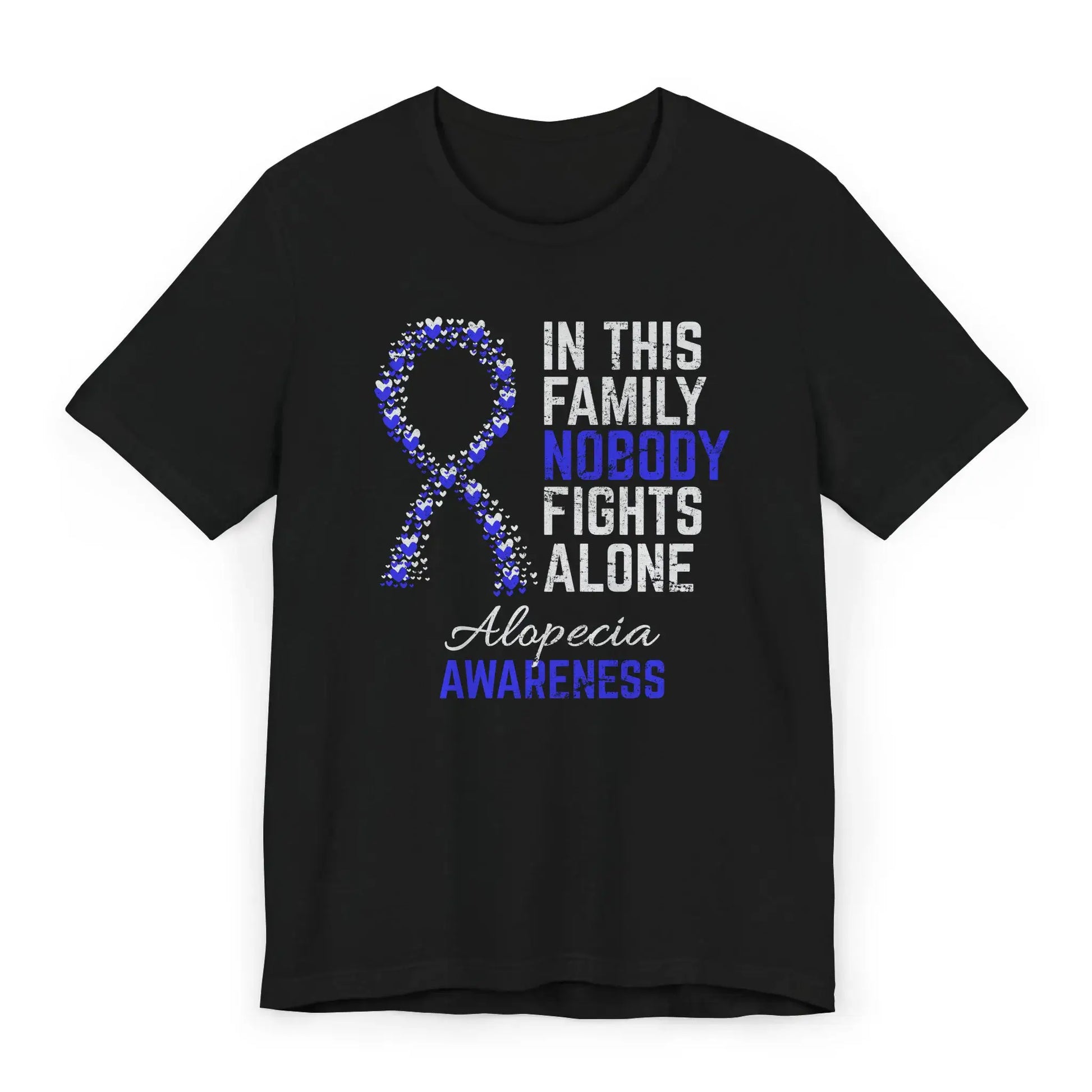 Flat image of the alopecia awareness T-shirt with a heart-filled ribbon and the quote “In This Family No One Fights Alone.”