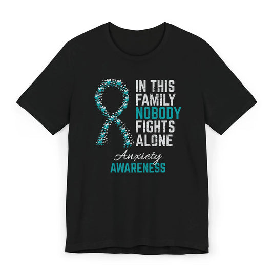 Flat image of the Anxiety Awareness T-shirt with a teal ribbon and quote supporting mental health warriors.