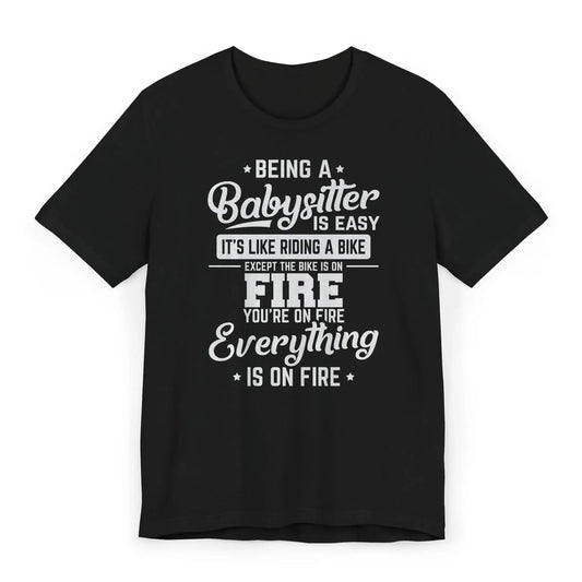 Babysitter shirt with cartoon flames and text Being a Babysitter Is Easy Everything Is on Fire
