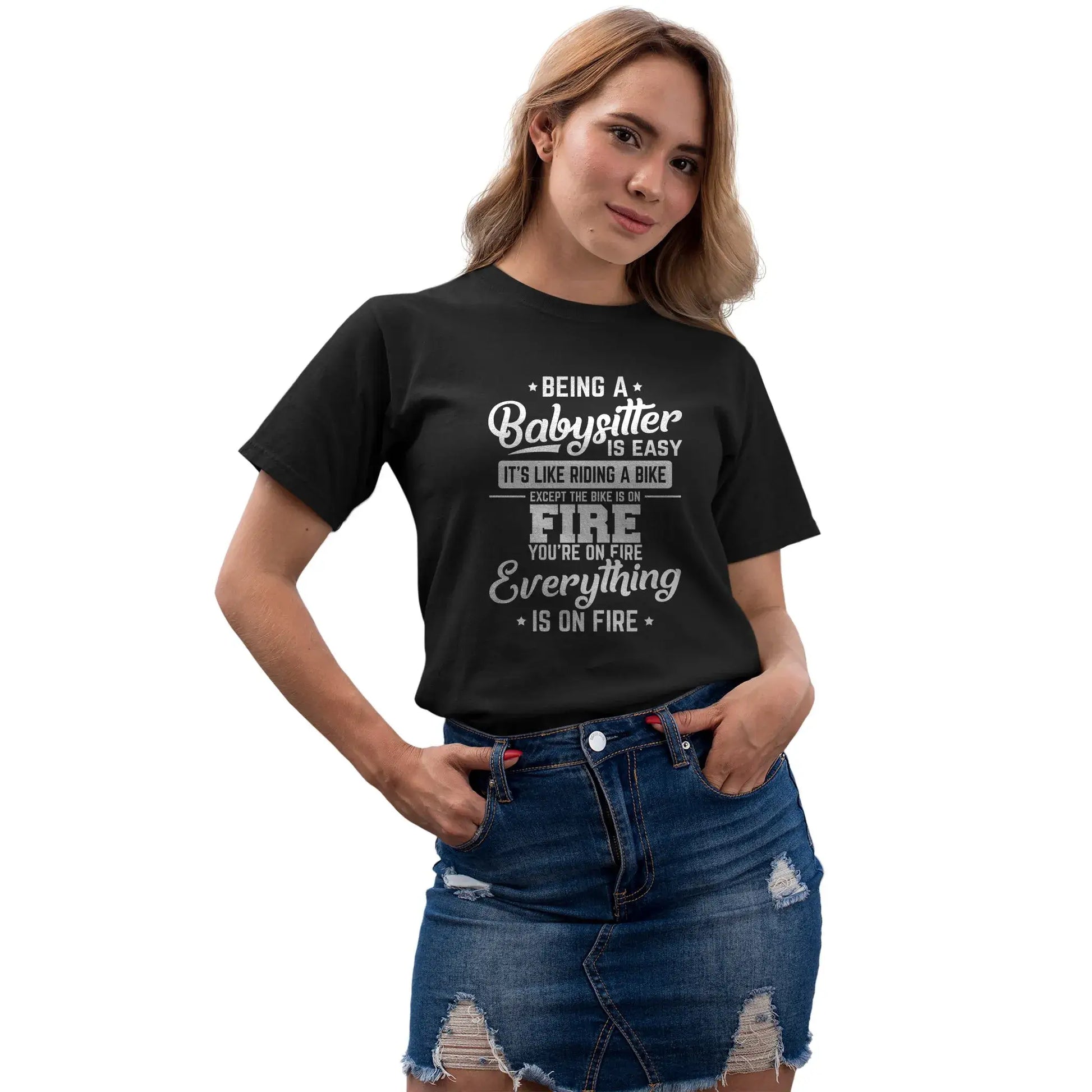 Women’s chaotic humor babysitter shirt with bold fire illustration and parenting quote