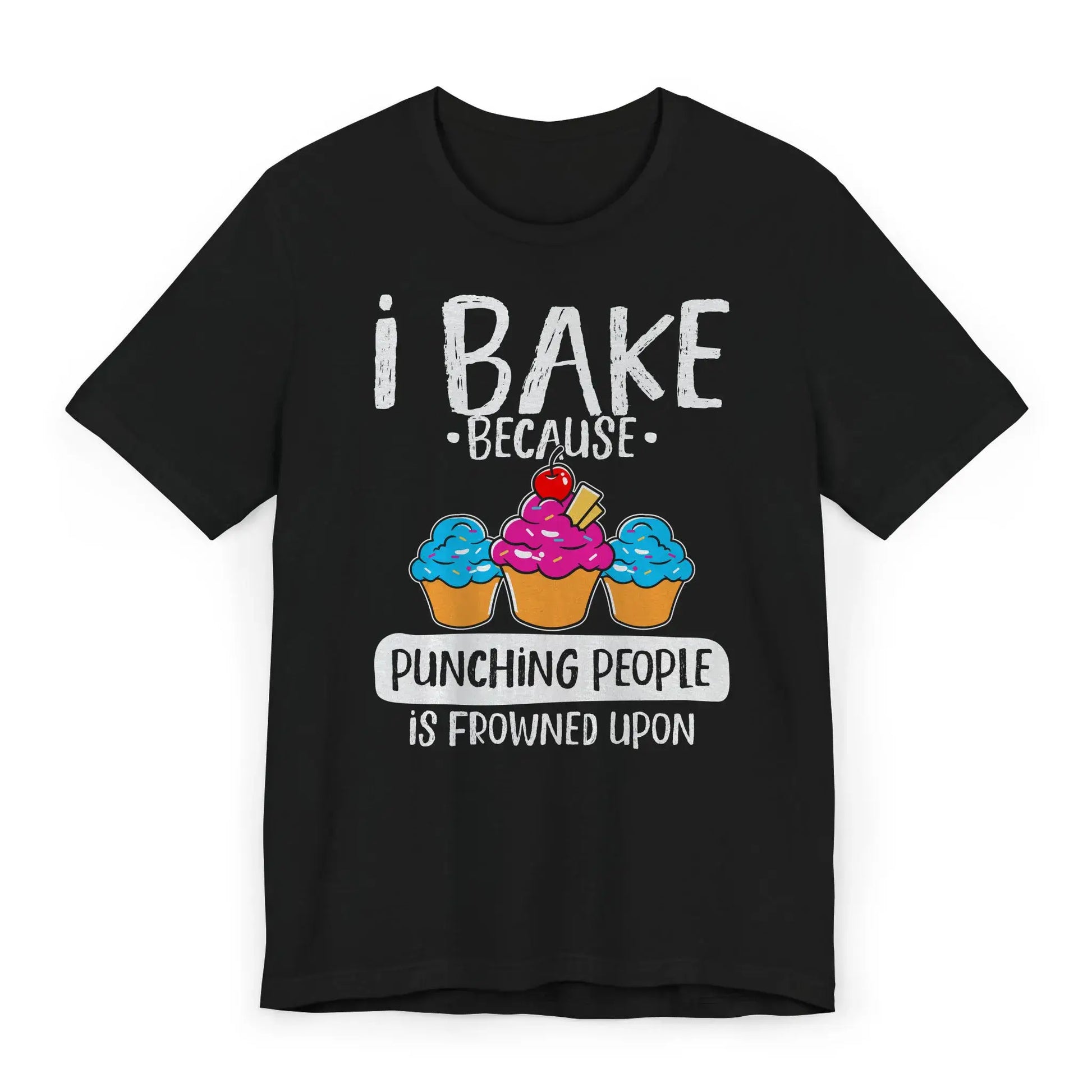 Flat lay of T-shirt with pink whisk and text I Bake Because Punching People Is Frowned Upon