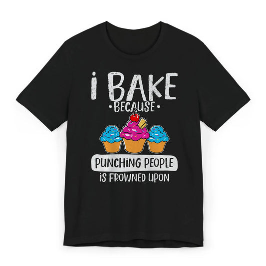 Flat lay of T-shirt with pink whisk and text I Bake Because Punching People Is Frowned Upon