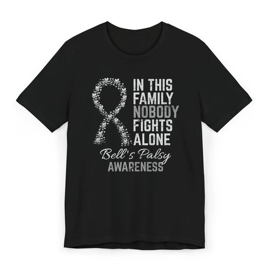 Flat image of the Bell’s palsy awareness T-shirt with a heart-filled ribbon and the quote “In This Family No One Fights Alone.”