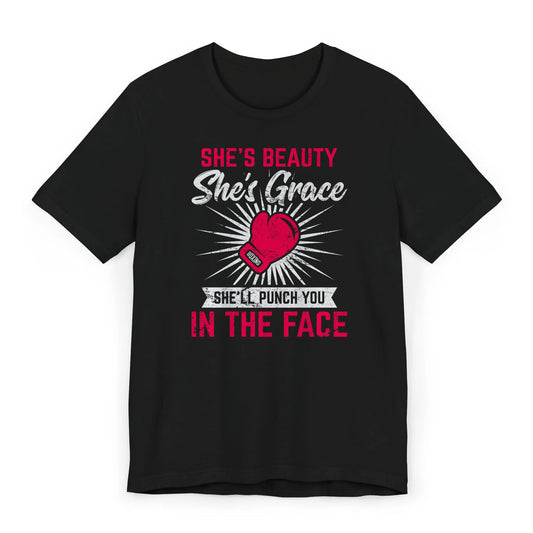 Flat image of a women’s boxing shirt with the quote “She’s Beauty, She’s Grace, She’ll Punch You in the Face.”