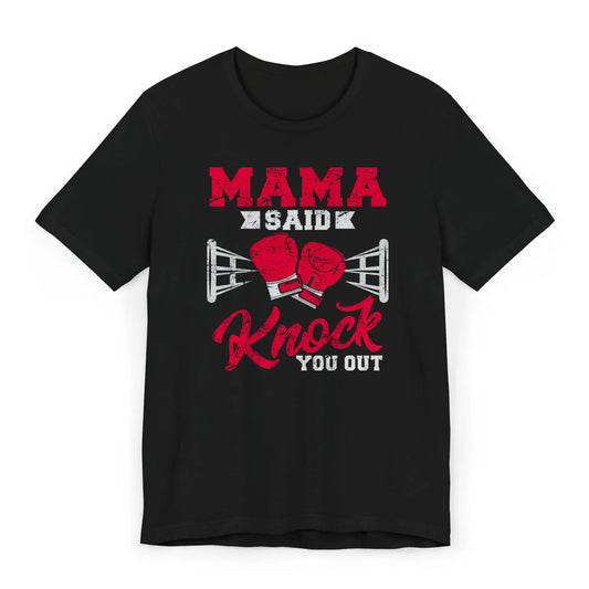 Flat lay of a boxing mom shirt with gloves and bold "Mama Said Knock You Out" quote.
