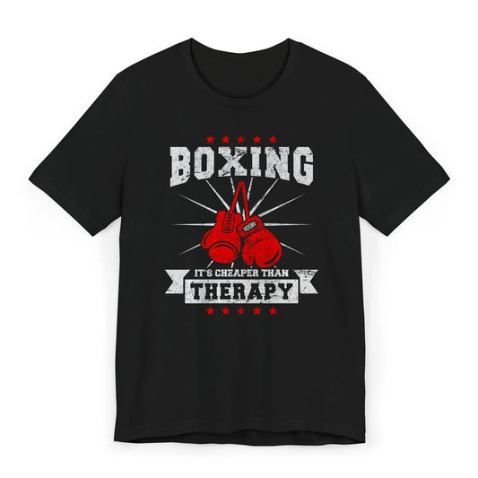 Flat lay of a funny boxing shirt with red gloves and the quote “Boxing – It’s Cheaper Than Therapy.”