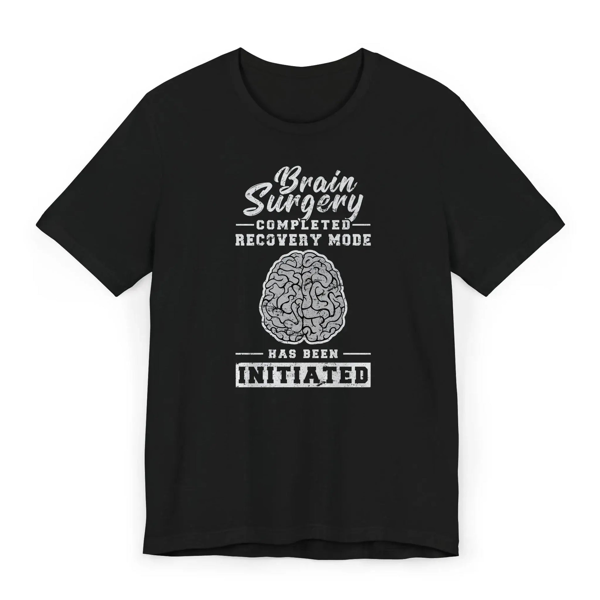 Flat lay of brain surgery recovery shirt with brain graphic and quote “Recovery Mode Has Been Initiated.”
