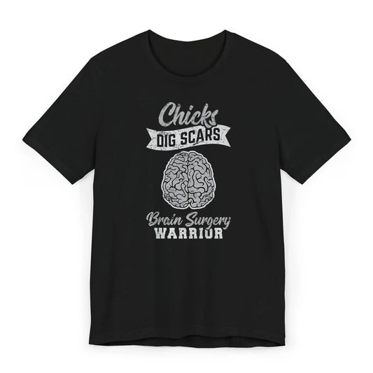 Flat lay of a funny brain surgery shirt with brain illustration and quote “Chicks Dig Scars – Brain Surgery Warrior.”
