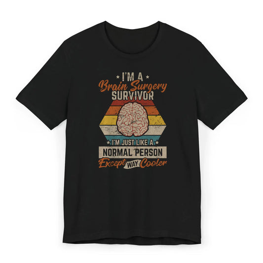 Flat lay of brain surgery survivor shirt with vintage colors and quote “Except Way Cooler.”