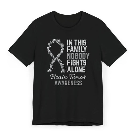 The flat image shows a Brain Tumor Awareness T-shirt with a heart-filled ribbon and quote offering strength and support to those affected by brain tumors.