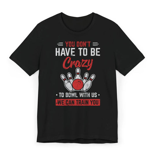 Flatlay of bowling shirt with “You Don’t Have to Be Crazy to Bowl With Us” slogan
