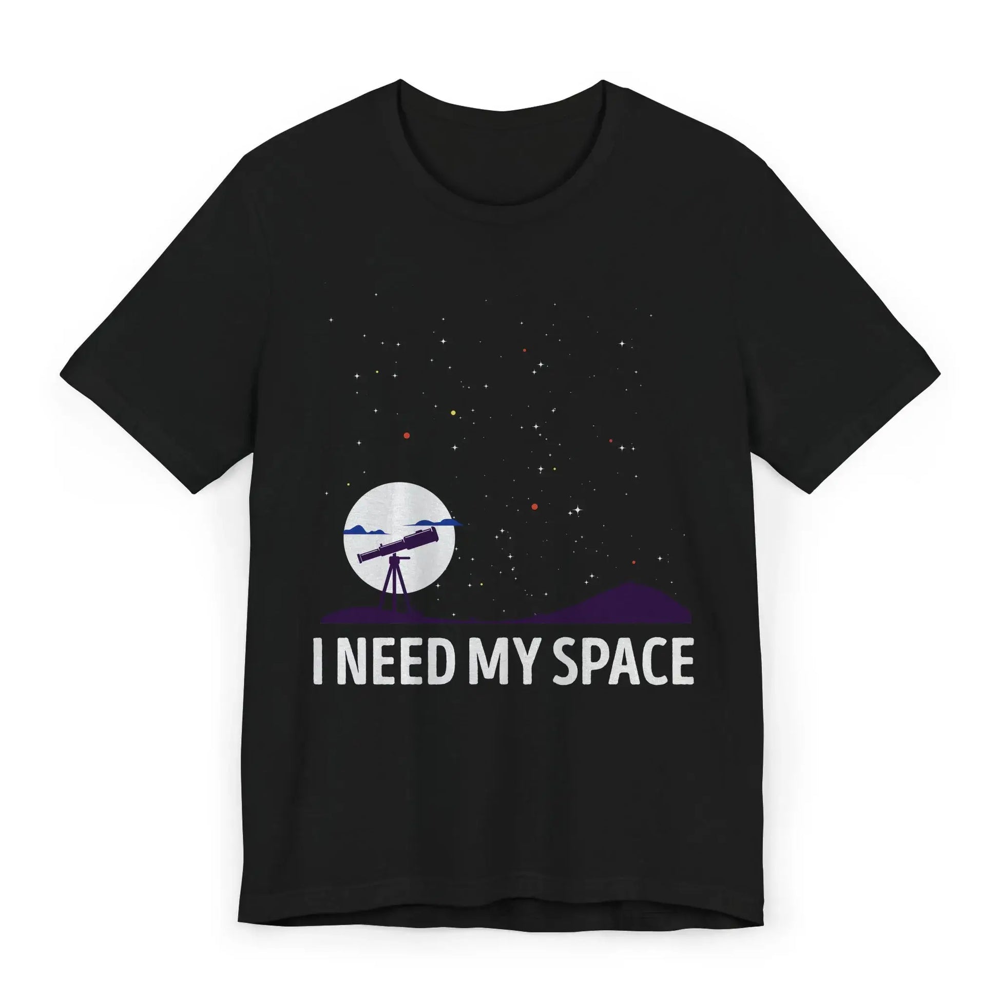 Flatlay of I Need My Space shirt with telescope and stars