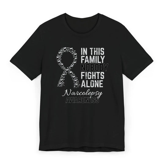 Flat image of the Narcolepsy Awareness T-shirt with a black ribbon and quote supporting those with chronic sleep disorders.