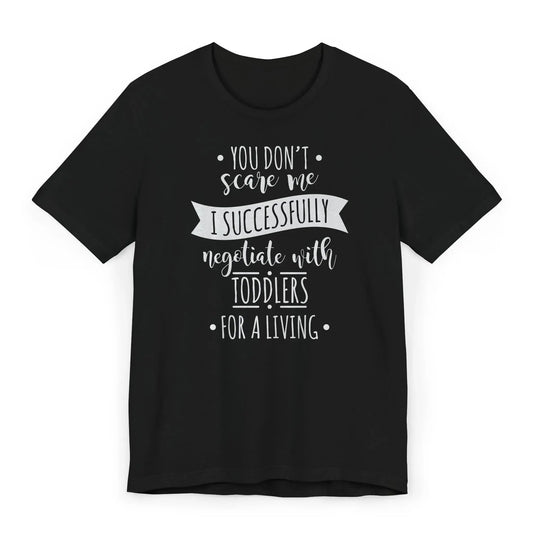 Funny babysitter shirt with white and pink text I Successfully Negotiate with Toddlers for a Living