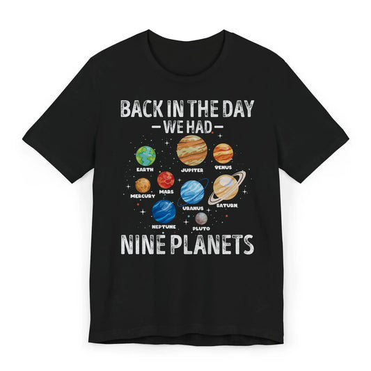 Flatlay of Nine Planets solar system shirt with Pluto included
