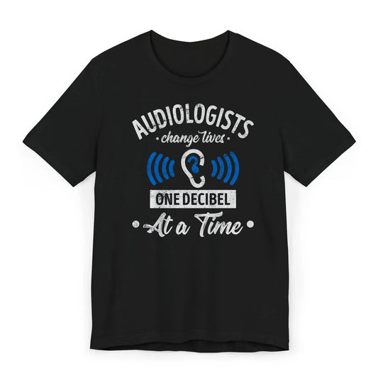 Flatlay of One Decibel at a Time shirt for hearing professionals