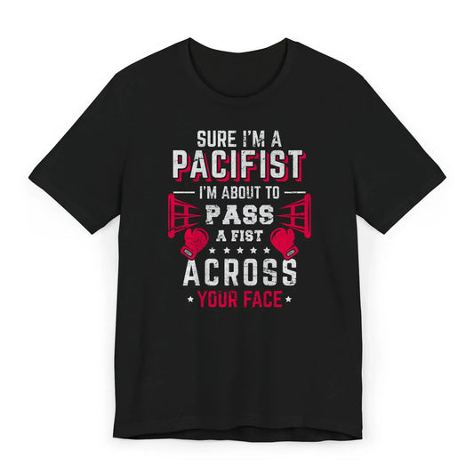 Flat lay of a funny boxing shirt with gloves and the quote “Sure I'm a Pacifist, I'm About to Pass a Fist.”