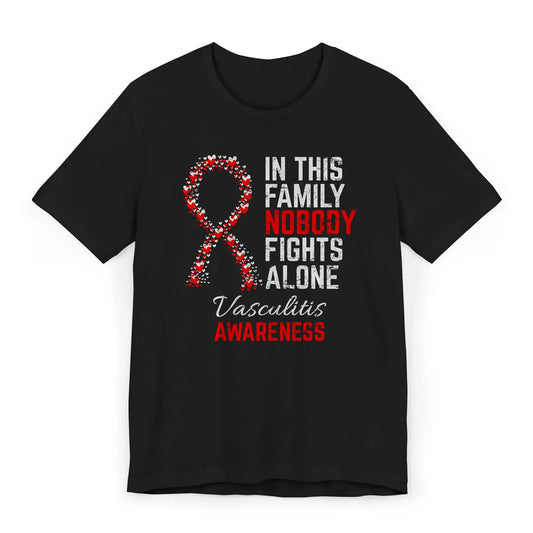 Flat image of the vasculitis awareness T-shirt with a heart-filled ribbon and the quote “In This Family No One Fights Alone.”